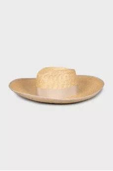 Straw hat decorated with a bow