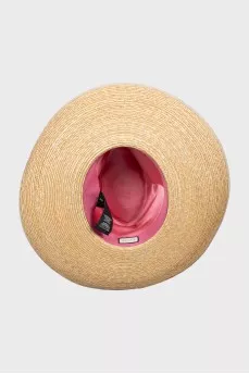 Straw hat decorated with a bow