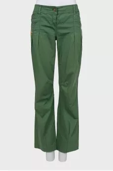 Green trousers decorated with rhinestones