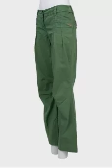 Green trousers decorated with rhinestones