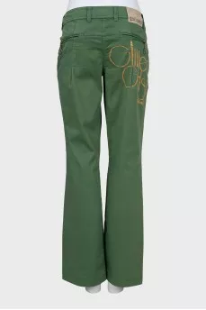 Green trousers decorated with rhinestones