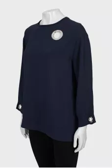 Loose blouse decorated with eyelet