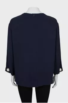 Loose blouse decorated with eyelet