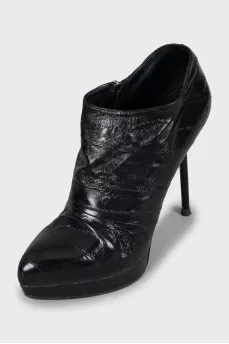 Black leather ankle boots with stiletto heels