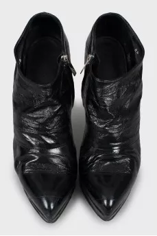Black leather ankle boots with stiletto heels