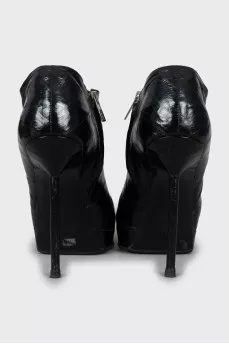 Black leather ankle boots with stiletto heels