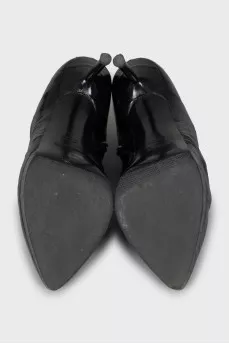 Black leather ankle boots with stiletto heels