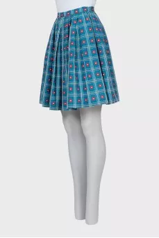 Pleated skirt decorated with embroidery