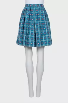 Pleated skirt decorated with embroidery