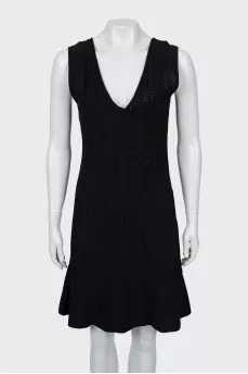 Fitted black dress with perforations