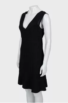 Fitted black dress with perforations