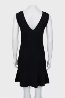 Fitted black dress with perforations