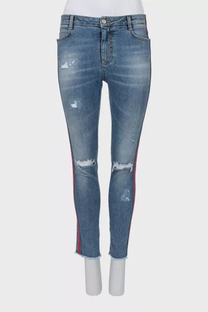 Jeans with stripes and ripped effect