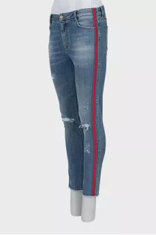 Jeans with stripes and ripped effect