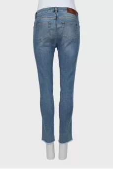 Jeans with stripes and ripped effect