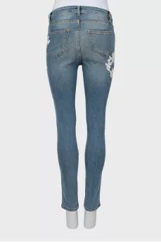 Skinny jeans decorated with lace