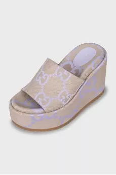 Sandals in a signature print on a wedge heel