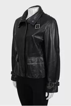 Leather jacket decorated with buckles