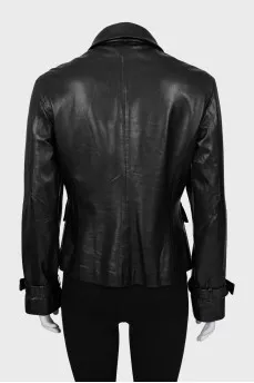 Leather jacket decorated with buckles