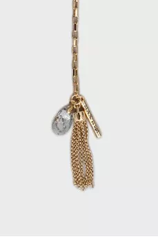 Golden pendant decorated with rhinestones