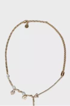 Golden pendant decorated with rhinestones