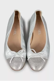 Silver ballet flats decorated with bows