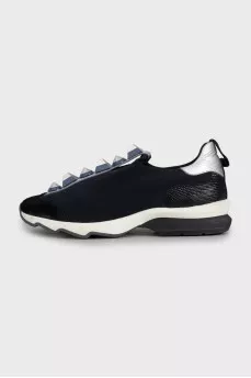 Textile sneakers decorated with spikes