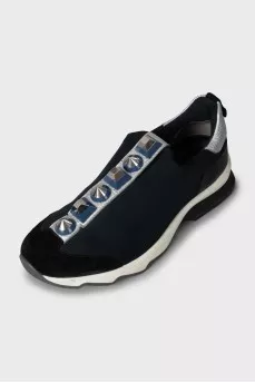 Textile sneakers decorated with spikes