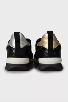 Textile sneakers decorated with spikes