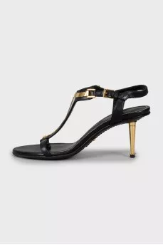 Leather sandals with golden stiletto heels
