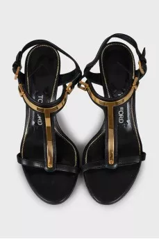 Leather sandals with golden stiletto heels
