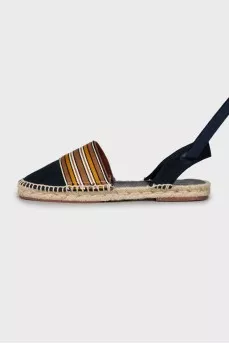 Textile sandals with woven soles