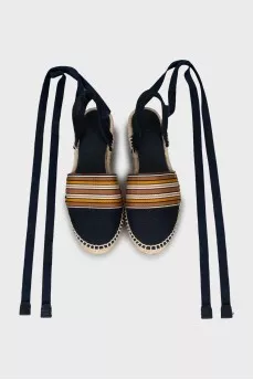 Textile sandals with woven soles