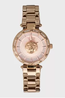 Golden watch with rhinestones on the dial