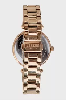 Golden watch with rhinestones on the dial