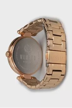 Golden watch with rhinestones on the dial