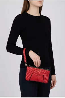 Quilted clutch with gold hardware