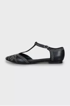 Black leather shoes with silver decor