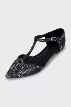 Black leather shoes with silver decor