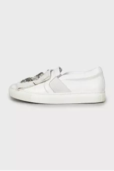 Leather slip-ons decorated with rhinestones