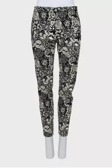 Trousers with stitched creases in a print