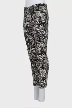 Trousers with stitched creases in a print