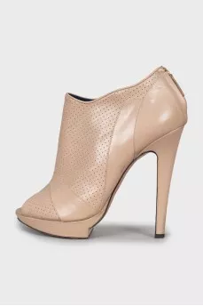 Beige ankle boots with perforation