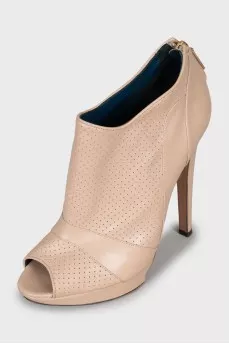 Beige ankle boots with perforation
