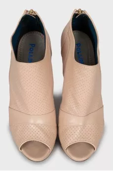 Beige ankle boots with perforation