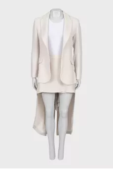 Beige suit with tailcoat and skirt