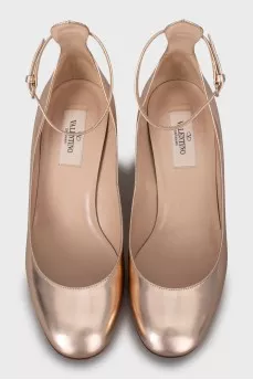 Gold colored mid heel shoes