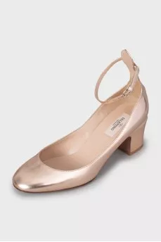 Gold colored mid heel shoes