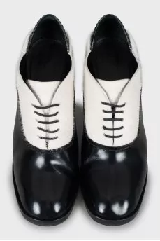 Black and white pony skin ankle boots