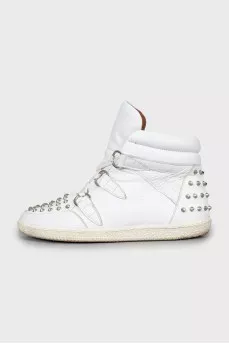 Leather sneakers decorated with spikes